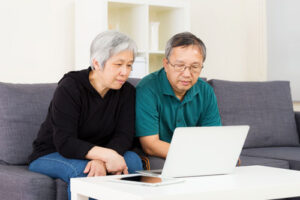 photo of mature couple with laptop