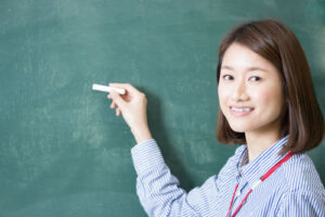photo of teacher at blackboard