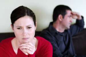 photo of worried couple in dispute